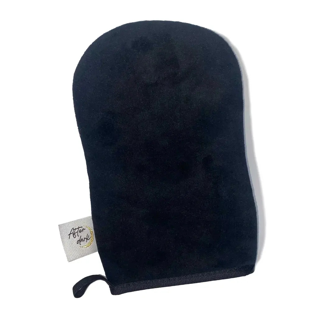 Black tanning mitt with a small white label on the left-hand side with 'After Dark' in black text.