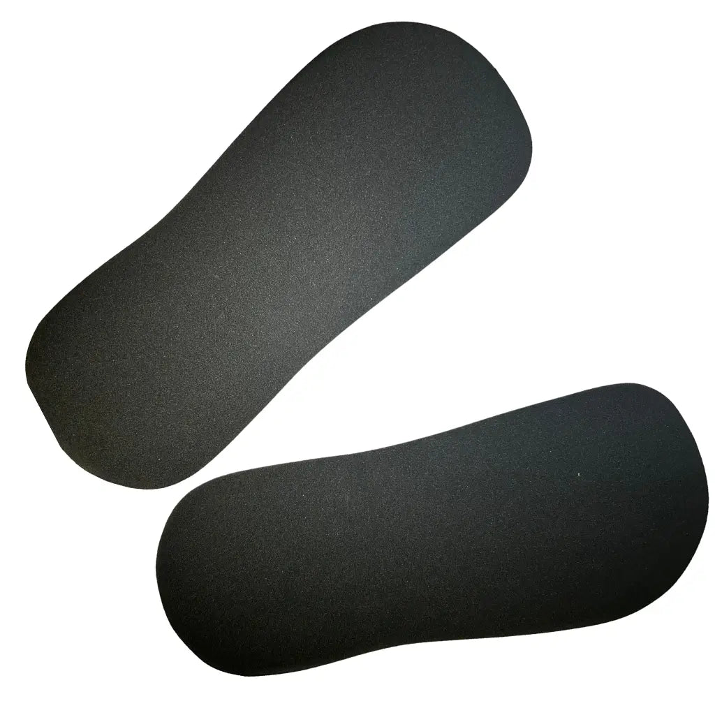 Black rounded-oblong shaped feet pads used for spray tanning.